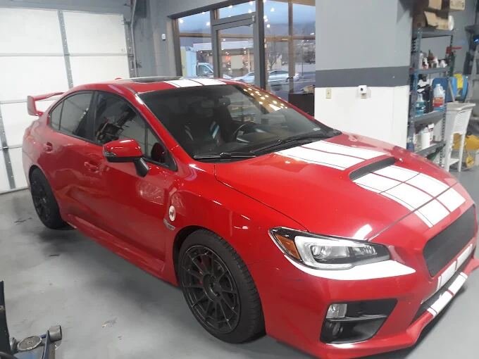 Red Subaru WRX STI in the shop