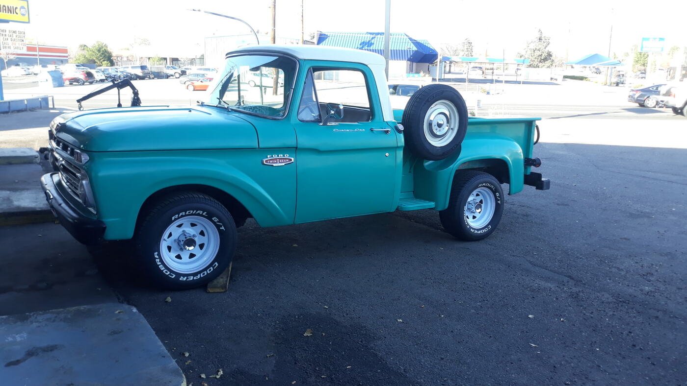 Restored classic pickup truck in turquoise