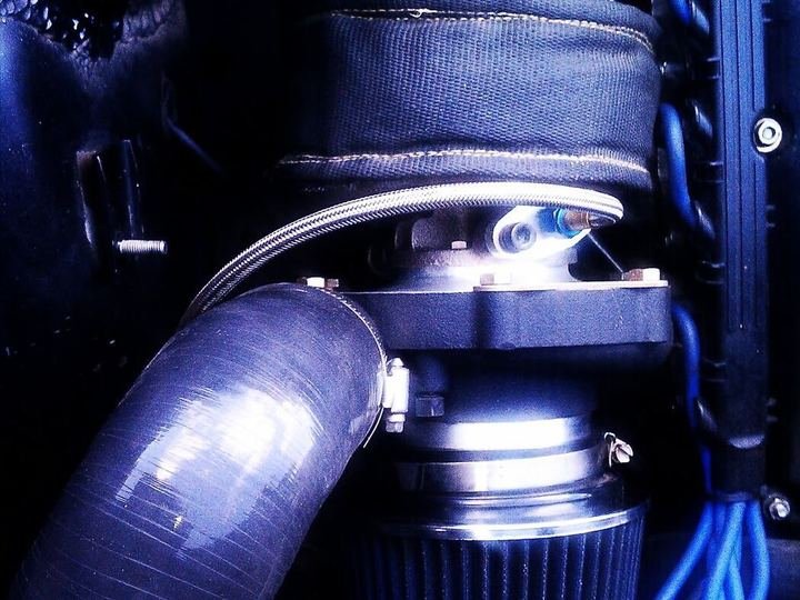 Close-up of a turbocharger and cold air intake