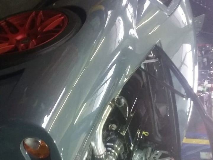 Sports car engine bay with custom intercooler piping